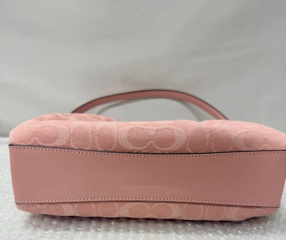 Pink quilted handbag with an orange card featuring 'Fancy Tokyo Tokyo' on a white background
